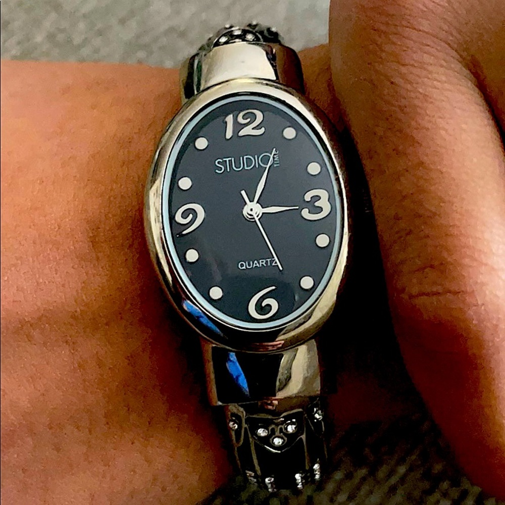 Black and silver cuff watch.